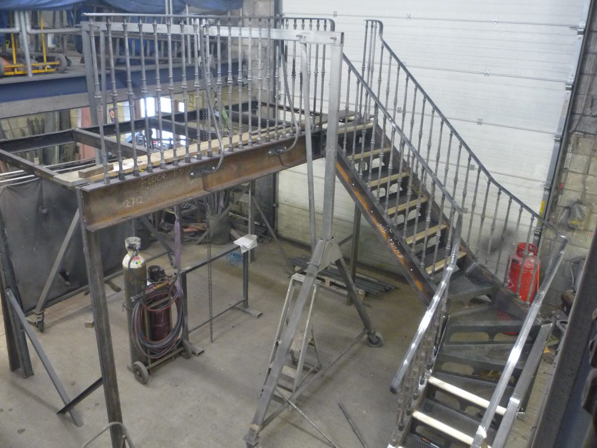 A photograph of a stunning new staircase for a private client in Chelsea manufactured by Calibre Metalwork.