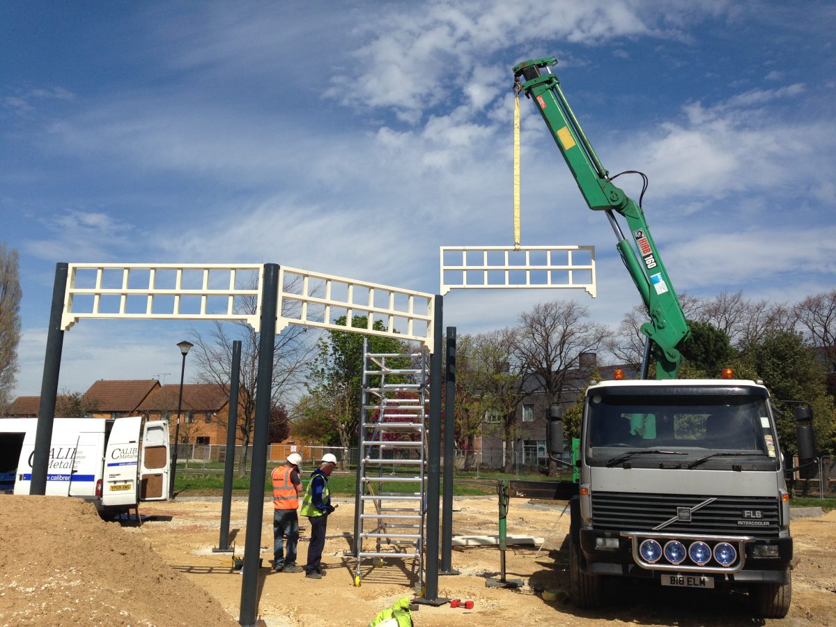 A photograph of Bentley Park Bandstand being installed onto the previously installed foundation pads.
