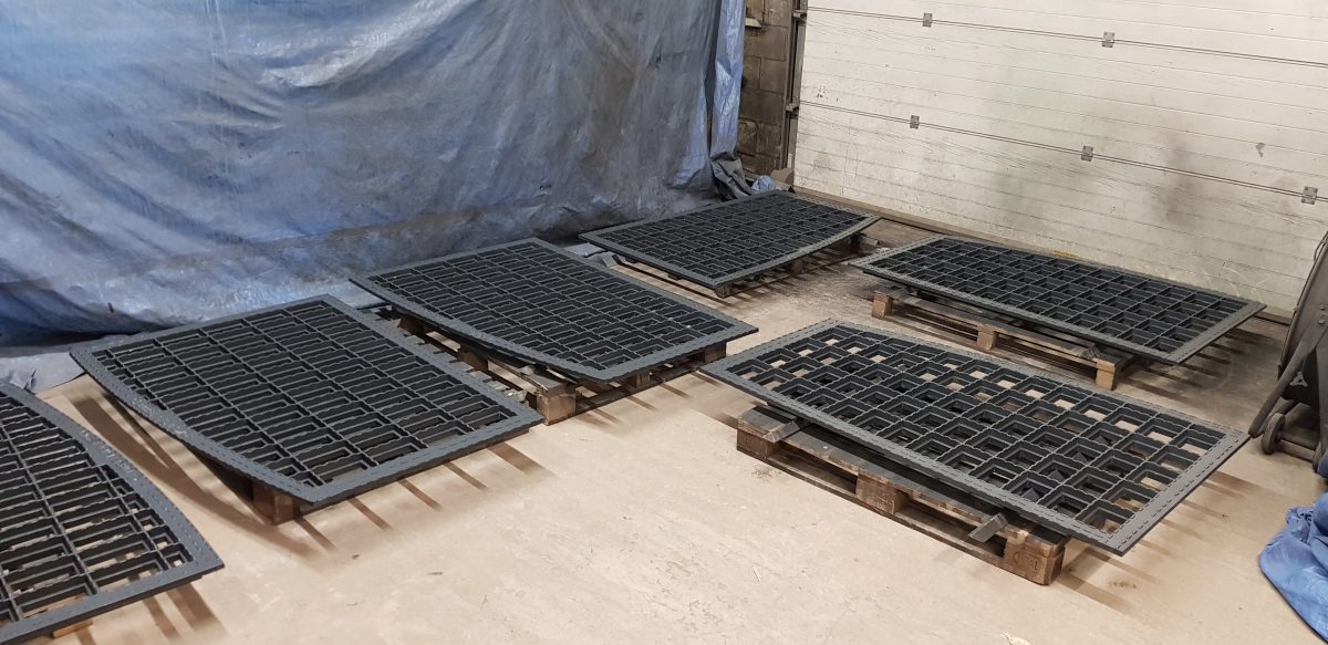 A photograph of the new grey iron castings for the pavement lights at Dale Street, Manchester replicated by Calibre Metalwork.