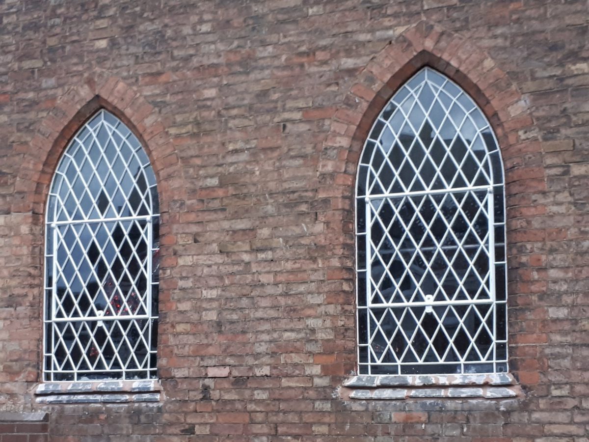 Photograph of the fully restored windows at St. Marys School, Hinkley placed back into their original openings by Calibre Metalwork.