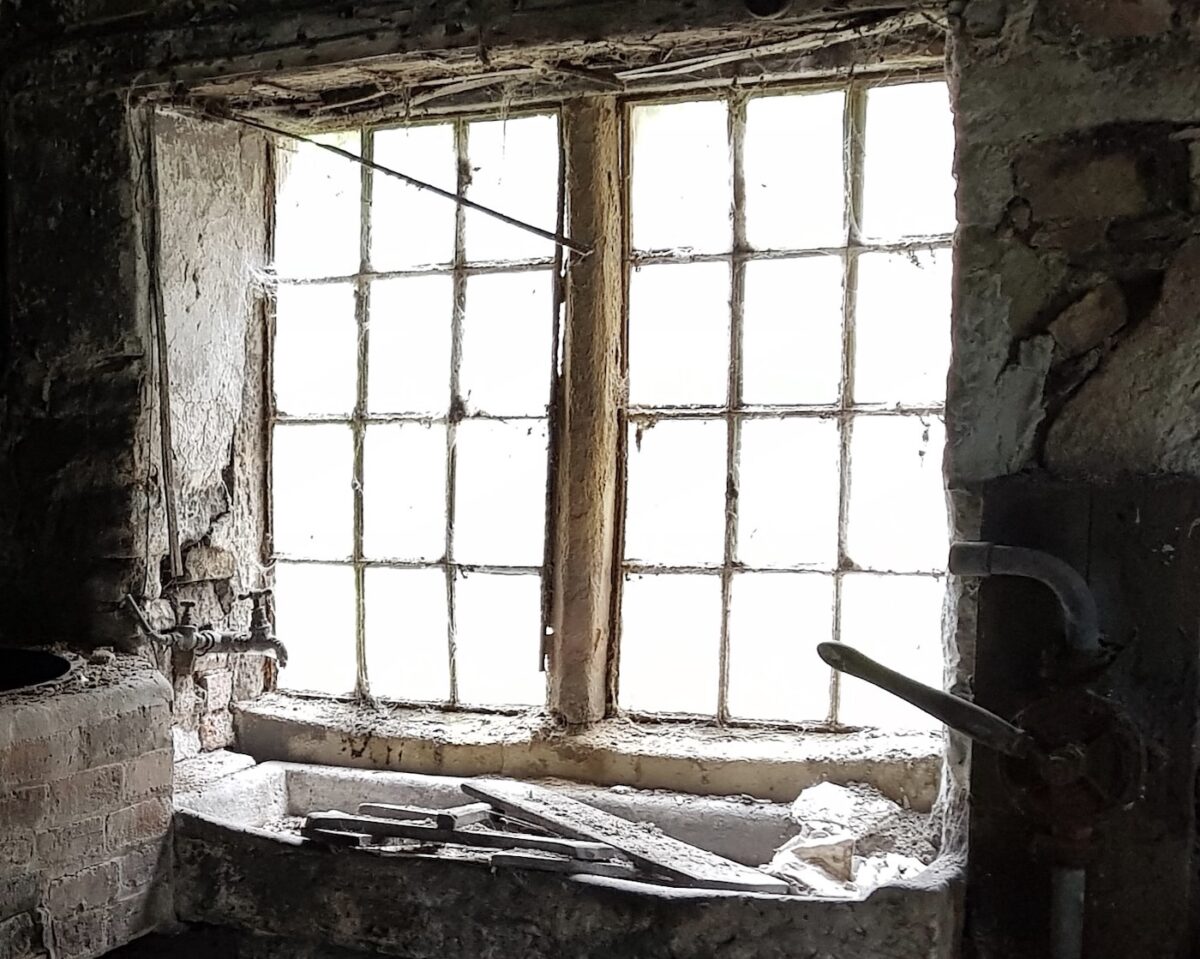 An old photograph of corroded iron frames in a private house in Ashbourne, Derbyshire.