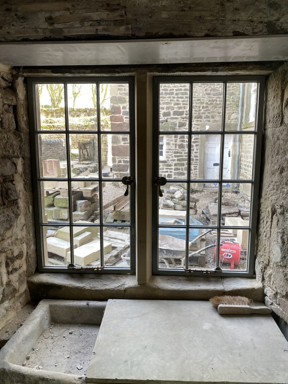 A photograph of the view from inside the private house in Derbyshire looking out from the replicated windows.