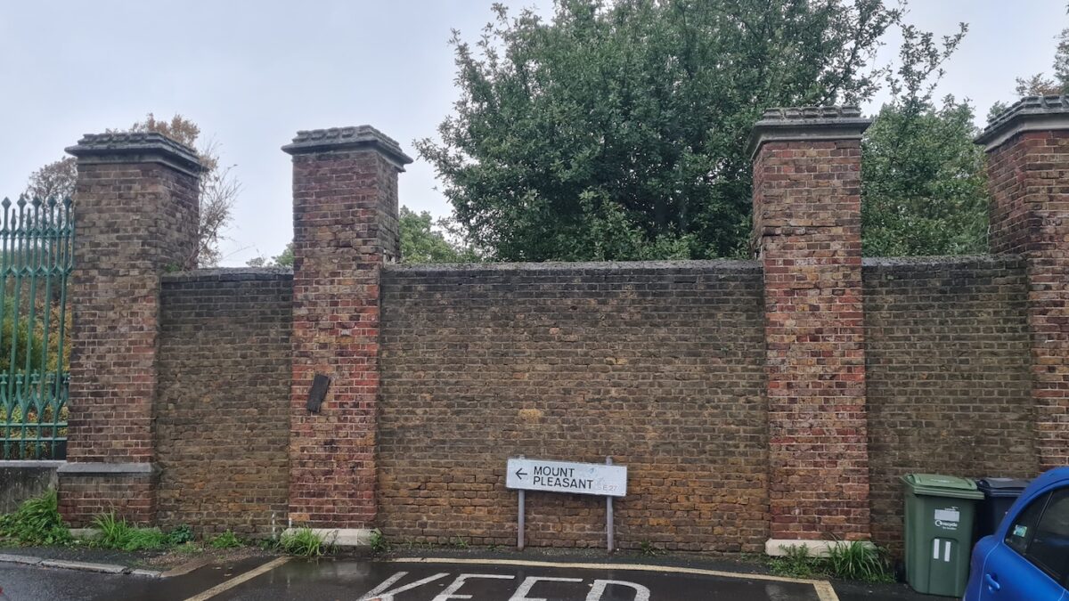 Photograph of a bricked entrance at West Norwood Cemetry in London.