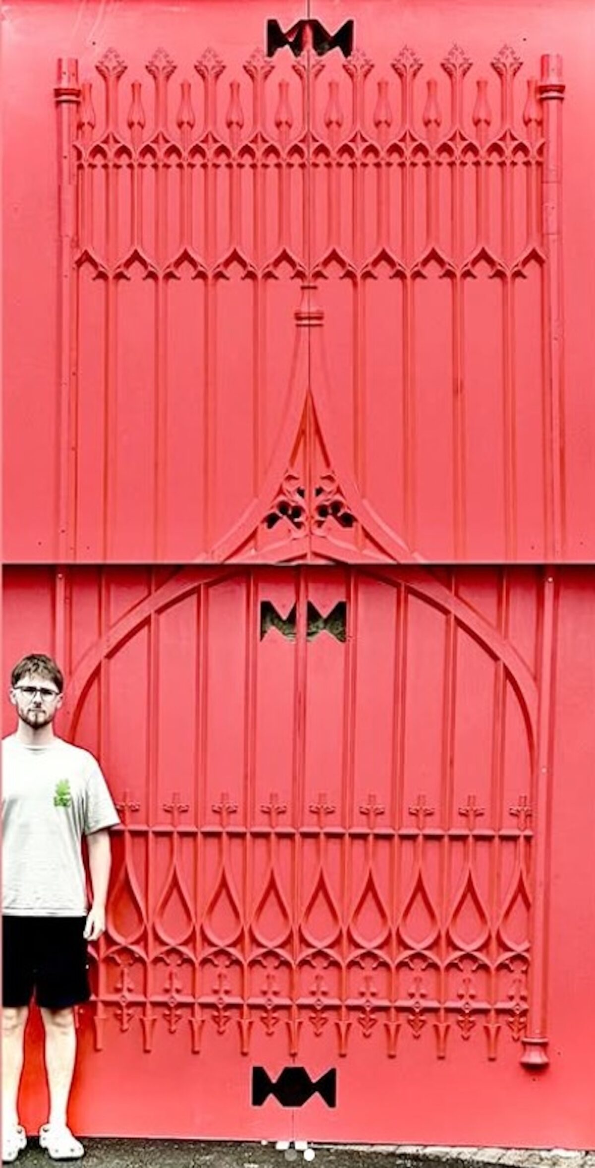Photograph of the patterns in two halves with an adult stood against them for scale.